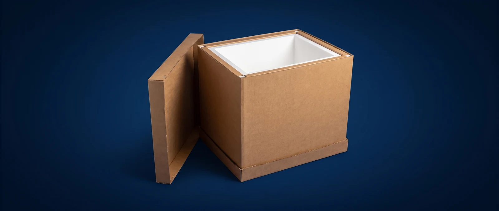 Large heavy-duty insulated bulk shipping cooler on a pallet, lid resting alongside