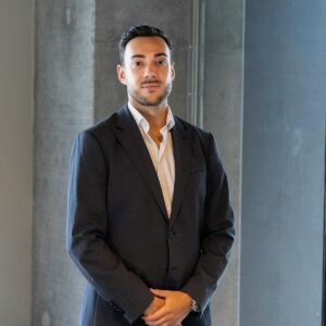 a man in a suit standing in a room